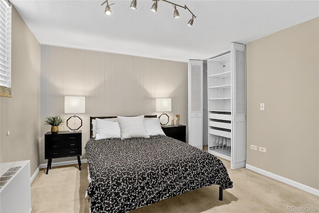 909 N Logan St Unit 1B, Denver, CO 80203 - bedroom with light colored carpet and baseboards