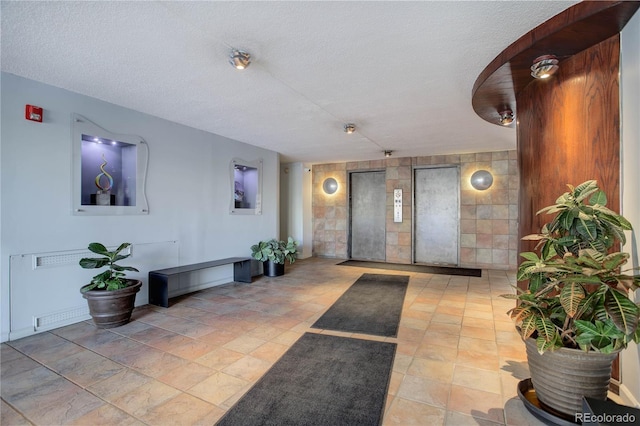 909 N Logan St Unit 1B, Denver, CO 80203 - common area with a textured ceiling