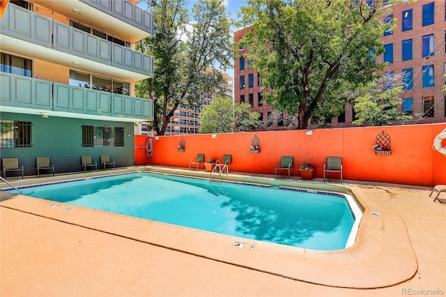 909 N Logan St Unit 1B, Denver, CO 80203 - community pool featuring a patio area