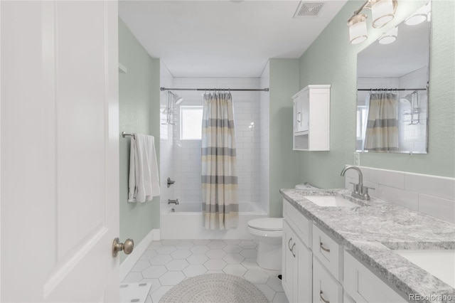 4933 Grove St, Denver, CO 80221 - full bathroom with shower / tub combo with curtain, toilet, tile patterned floors, and double vanity