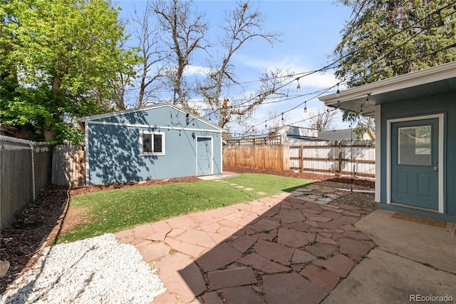 4933 Grove St, Denver, CO 80221 - view of yard featuring a patio area and an outbuilding