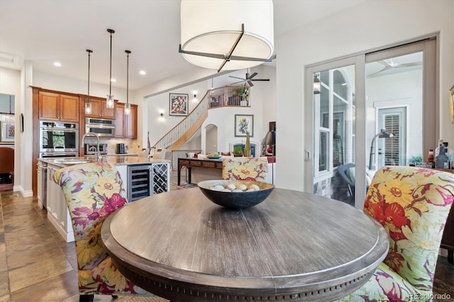 dining room with recessed lighting and stairway