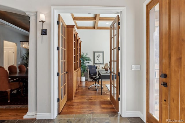 hallway with french doors, crown molding, baseboards, beamed ceiling, and coffered ceiling