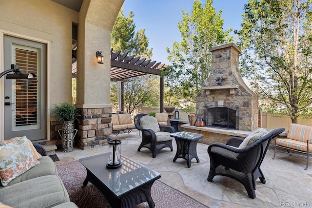 view of patio featuring fence, an outdoor living space with a fireplace, and a pergola