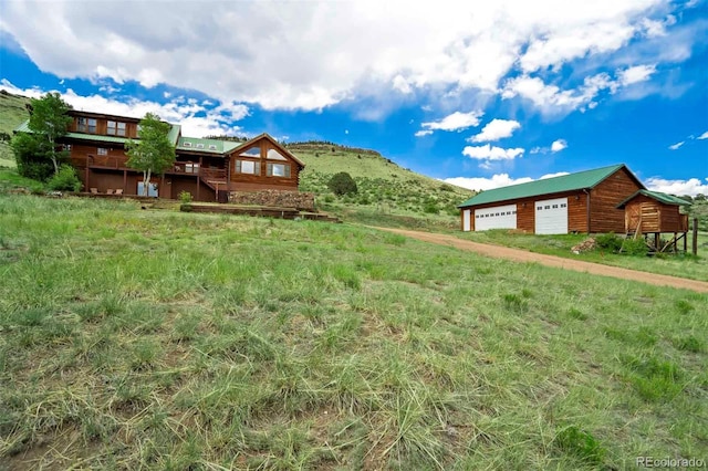 660 Wagon Wheel Rd, Guffey, CO 80820 - view of yard featuring a garage and an outdoor structure