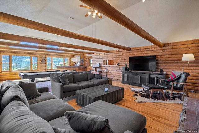 660 Wagon Wheel Rd, Guffey, CO 80820 - living area featuring log walls, billiards, beam ceiling, wood finished floors, and high vaulted ceiling
