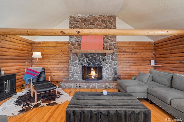660 Wagon Wheel Rd, Guffey, CO 80820 - living area featuring lofted ceiling, a fireplace, and wood finished floors
