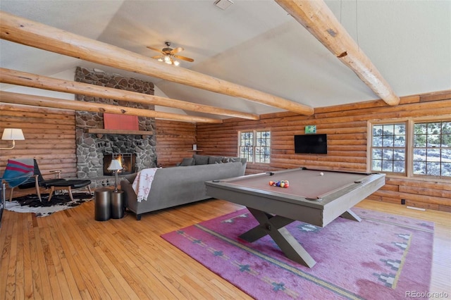 660 Wagon Wheel Rd, Guffey, CO 80820 - playroom featuring rustic walls, hardwood / wood-style flooring, billiards table, a stone fireplace, and ceiling fan