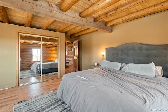 660 Wagon Wheel Rd, Guffey, CO 80820 - bedroom with a wooden ceiling with exposed beams, wood finished floors, and a closet
