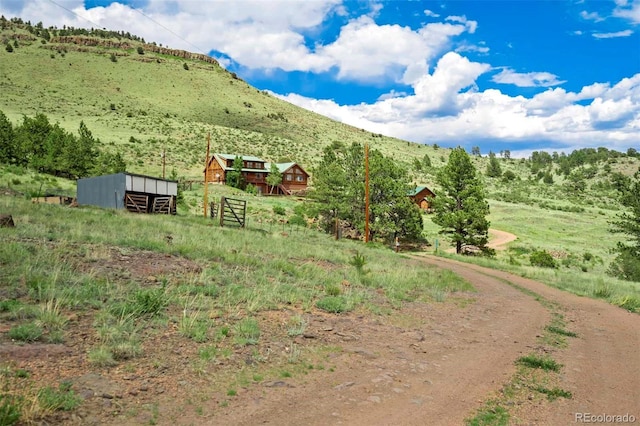 660 Wagon Wheel Rd, Guffey, CO 80820 - view of yard with a mountain view, a view of rural / pastoral area, and an outdoor structure