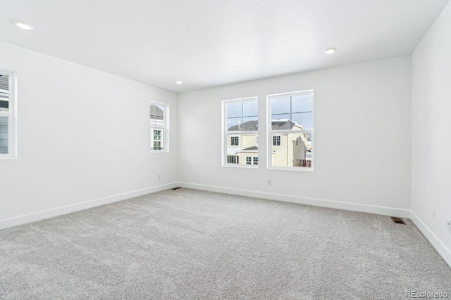 unfurnished room featuring carpet flooring