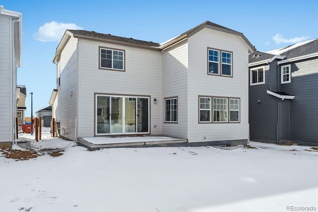 view of snow covered house