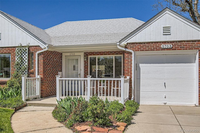 5703 Ammons St, Arvada, CO 80002 - view of front of home featuring brick siding, a garage, a shingled roof, and driveway