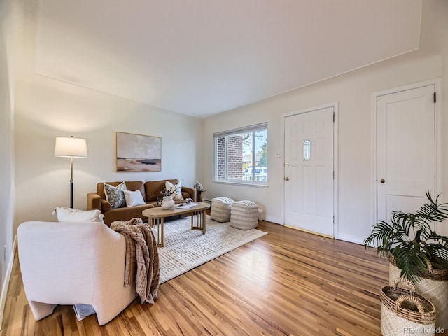5703 Ammons St, Arvada, CO 80002 - living room with light wood finished floors and baseboards