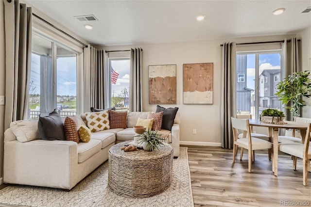 living room with light hardwood / wood-style floors