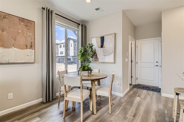 dining area featuring hardwood / wood-style flooring