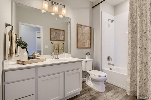 full bathroom with vanity, hardwood / wood-style floors, toilet, and shower / bathtub combination with curtain