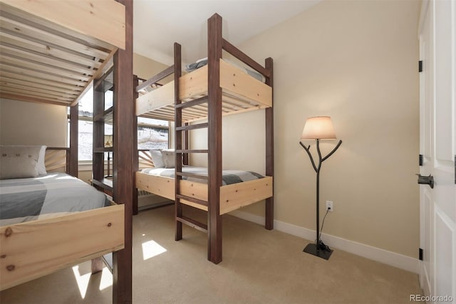 bedroom featuring carpet flooring and baseboards