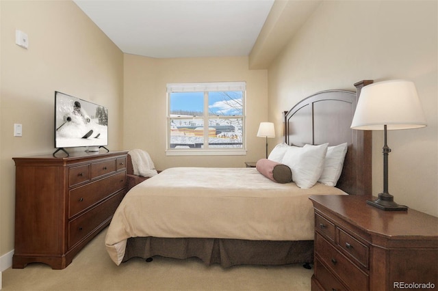 bedroom with light colored carpet