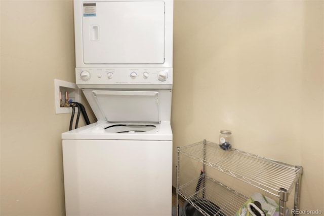 laundry area featuring laundry area and stacked washer / drying machine