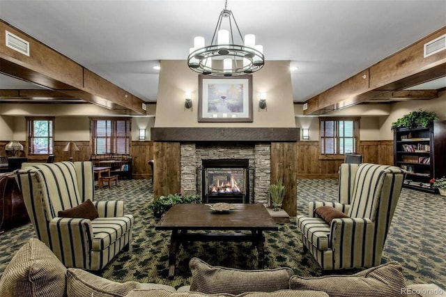 carpeted living room featuring wainscoting, wood walls, and visible vents