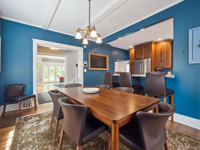 724 N Franklin St, Denver, CO 80218 - dining area featuring wood finished floors, baseboards, and beam ceiling