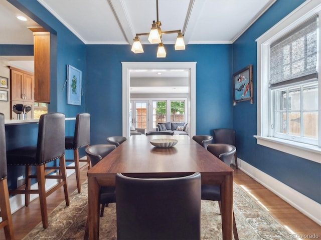 724 N Franklin St, Denver, CO 80218 - dining room with dark wood-style floors, crown molding, baseboards, and ceiling fan