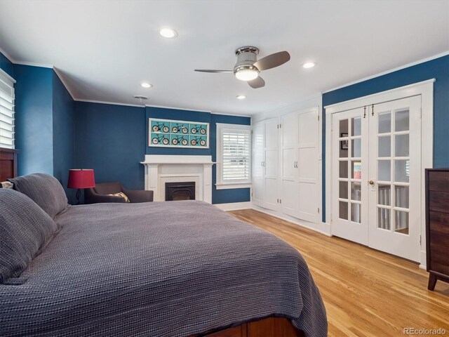 724 N Franklin St, Denver, CO 80218 - bedroom featuring light wood-type flooring, a fireplace, recessed lighting, french doors, and ornamental molding
