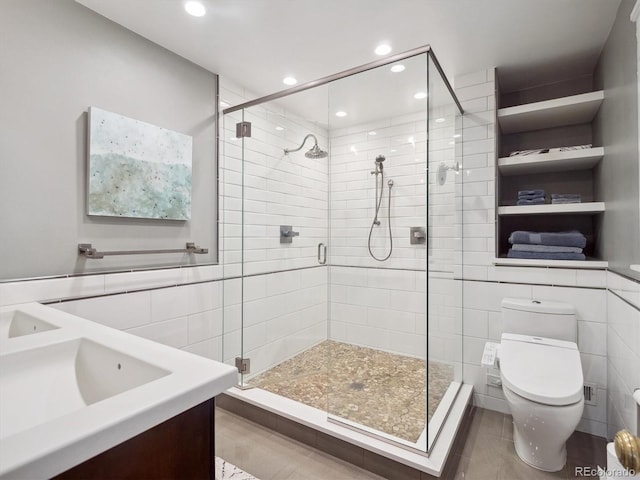 724 N Franklin St, Denver, CO 80218 - full bath with toilet, tile walls, a shower stall, vanity, and tile patterned floors