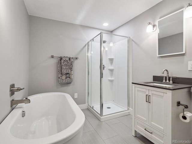 724 N Franklin St, Denver, CO 80218 - full bath featuring a shower stall, vanity, a freestanding tub, and recessed lighting