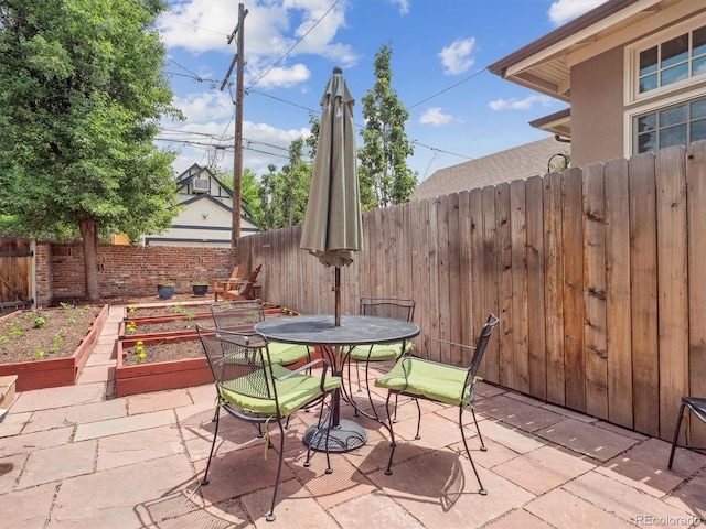 724 N Franklin St, Denver, CO 80218 - fenced backyard with a garden, a patio area, and outdoor dining area