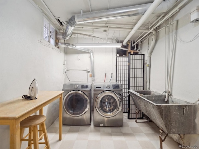 724 N Franklin St, Denver, CO 80218 - laundry area featuring washing machine and clothes dryer and tile patterned floors