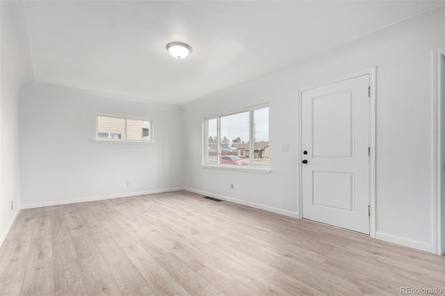 spare room with light hardwood / wood-style flooring