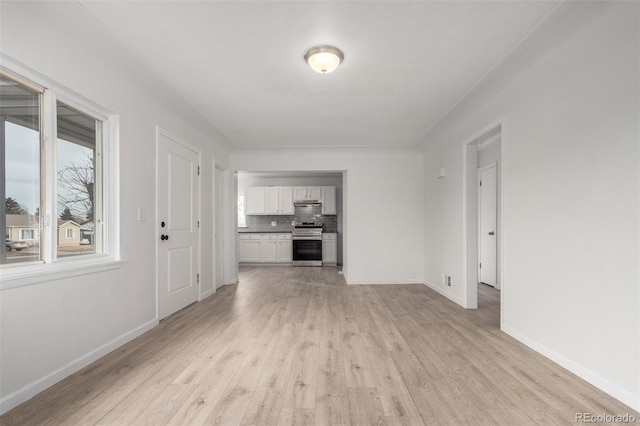 unfurnished living room featuring light hardwood / wood-style flooring