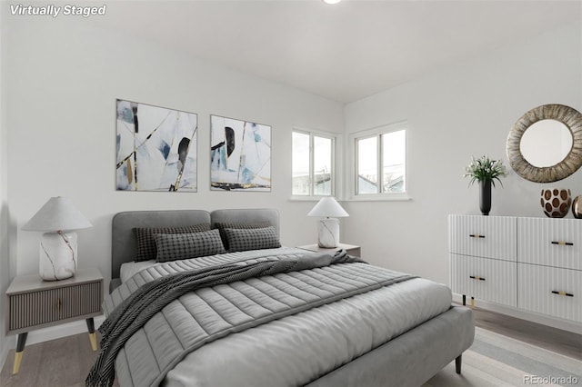 bedroom with light hardwood / wood-style floors