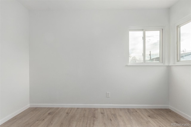 spare room with light hardwood / wood-style flooring