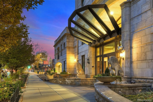 view of exterior entry at dusk