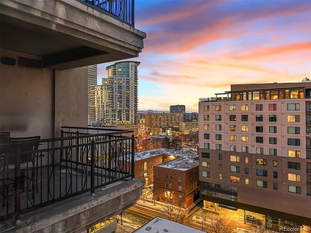 view of balcony at dusk