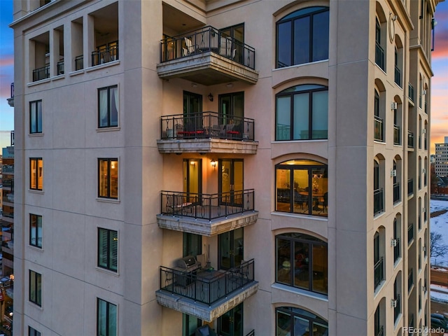 view of outdoor building at dusk