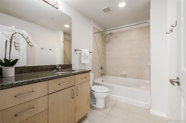 full bathroom with visible vents, toilet, vanity, shower / tub combination, and tile patterned floors