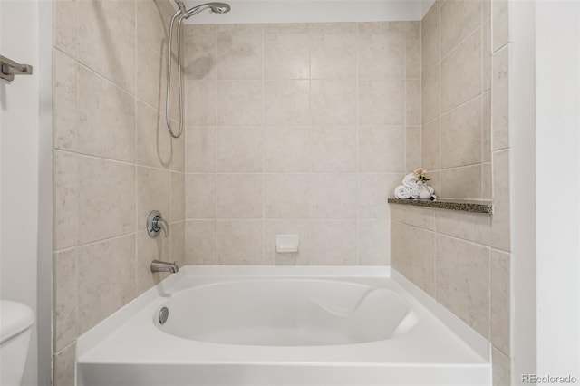 bathroom with shower / tub combination and toilet