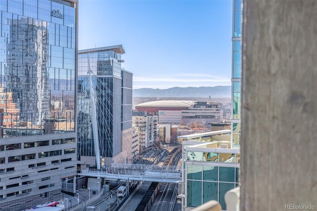 property's view of city featuring a mountain view