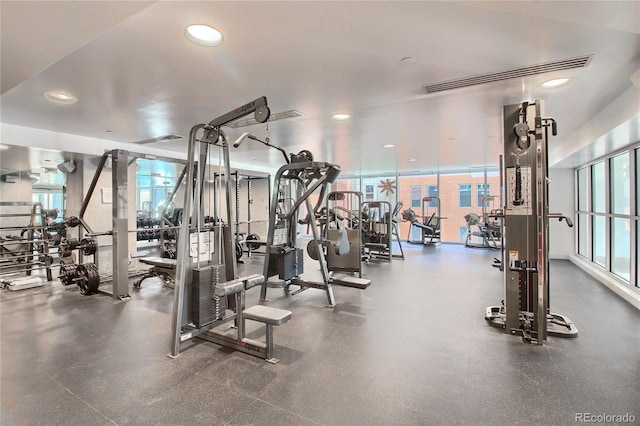 exercise room featuring visible vents, a wealth of natural light, and recessed lighting