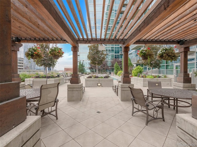 view of patio / terrace with outdoor dining space and a pergola