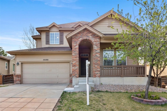 view of front of home with concrete driveway, a front lawn, an attached garage, brick siding, and a shingled roof