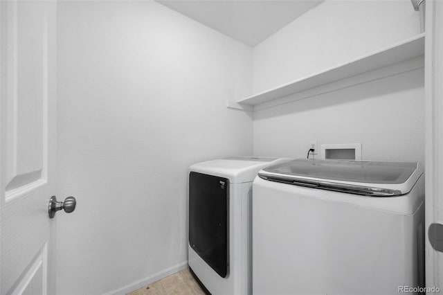 laundry room with independent washer and dryer, laundry area, and baseboards