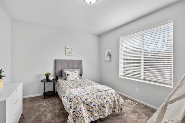 bedroom featuring visible vents, baseboards, and carpet