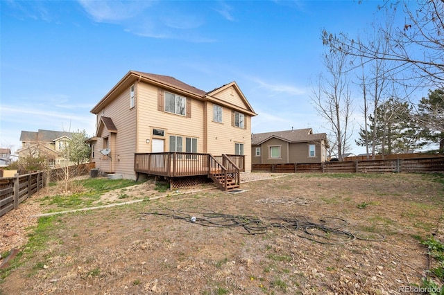 back of property featuring central AC, a fenced backyard, and a wooden deck