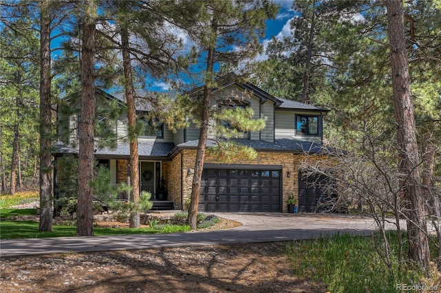 1410 Old Sequoia Ct, Franktown, CO 80116 - view of front of home with asphalt driveway and a garage