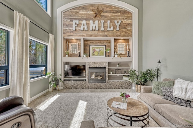 1410 Old Sequoia Ct, Franktown, CO 80116 - living area featuring carpet flooring, a tiled fireplace, and baseboards